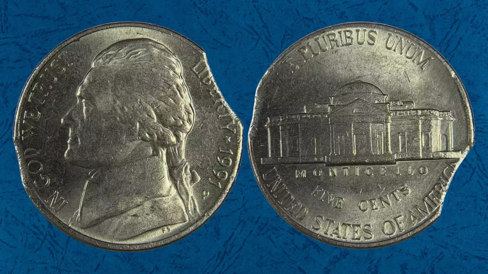 1991 Jefferson nickel clipped planchet error showing curved crescent cut from the coin's edge